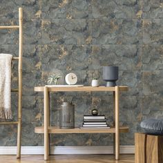 a wooden table sitting next to a wall covered in stone