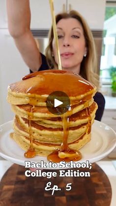 a woman is pouring syrup on a stack of pancakes with the words back to school college