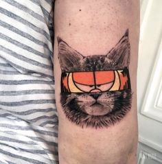 a cat with glasses on it's face is seen in this tattoo design by the artist