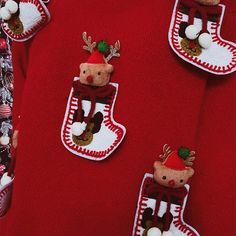 christmas stocking decorations on red sweaters with white balls