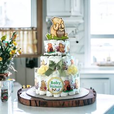 a three tiered winnie the pooh baby shower cake