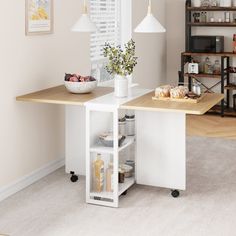 a white kitchen island with shelves and baskets on it in front of a dining room table