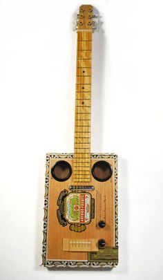 an electric guitar made out of wood and other things on it's back end