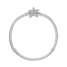 Bring celestial sparkle to your look with the Pandora Moments Asymmetric Star Clasp Snake Chain Bracelet. Hand-finished in sterling silver, the bracelet's star-shaped clasp is covered by sparkling clear cubic zirconia pavé on both sides. It can be worn with up to 16-18 desired charms and clips. Wear it on its own for a simple, understated look, or stack it with other celestial-inspired designs for a look that’s out of this world. Charms Pandora, Bracelet Pandora, Cz Bracelet, Bracelets Design, Snake Chain Bracelets, Golden Trio, Pandora Bracelet Charms, Jewelry Lookbook, Pandora Bracelets