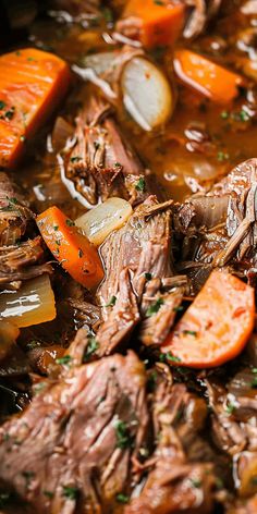 beef stew with carrots and onions in a pot