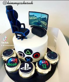 a birthday cake with cupcakes and video game memorabilia