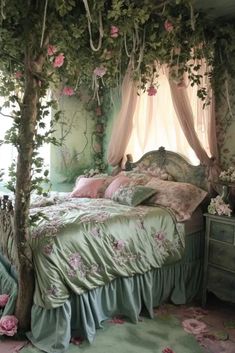 a canopy bed with pink flowers on it in a room that has green walls and flooring