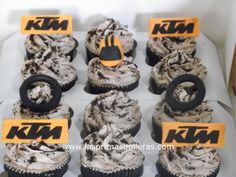 an assortment of cupcakes with icing and decorations for ktm's birthday