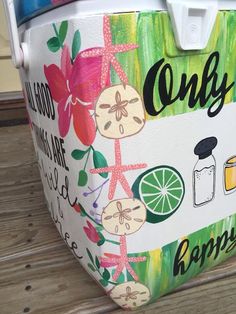 the cooler is decorated with flowers, lemons, and other things that are on it