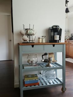 a kitchen cart with various items on it