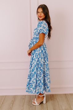 - Be a style inspiration with this sweet dress! - Material with a striped texture and a blue hued abstract print - A built-in skirt lining - An elastic scoop cut neckline - Short puff sleeves with elastic cuffs - A smocked bodice - A removable waist cinching tie closure belt - A relaxed silhouette that ends in a straight ankle length hemline Flowy Blue Midi Dress With Smocked Back, Blue Maxi Dress With Smocked Back For Brunch, Blue Bohemian Midi Dress With Smocked Back, Blue Short Sleeve Maxi Dress With Smocked Back, Blue Midi Dress With Smocked Back And Short Sleeves, Blue Short Sleeve Midi Dress With Smocked Back, Blue Flowy Dress With Smocked Back, Smocked Maxi Dress, Skirt Lining