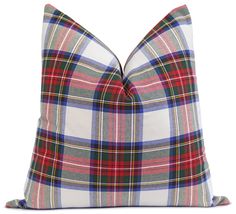 a plaid pillow on a white background