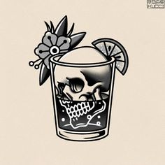 a skull in a glass with an orange slice and flower on the rim, is shown