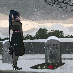 a woman standing in the snow next to a grave