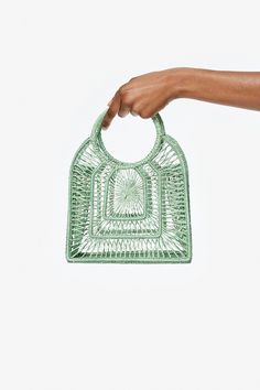 Our Olivia bag is playful and chic. It has a structured silhouette and a delicate woven design all handmade in Iraca Palm. It comes with a small pouch to keep all your belongings private. Wear yours with your best beach to bar look. Details: Composition: 100% Iraca Palm Handmade in Colombia Keep in mind all of our products are handmade and may vary slightly in size and color. Chic Woven Top Handle Beach Bag, Chic Shoulder Bag With Top Handle And Open Weave, Chic Top Handle Shoulder Bag With Open Weave, Chic Open Weave Top Handle Shoulder Bag, Woven Straw Pouch Bag For Shopping, Green Pouch Straw Bag For Vacation, Summer Square Straw Bag With Detachable Handle, Top Handle Open Weave Beach Bag, Vacation Top Handle Shoulder Bag With Open Weave