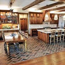 a large kitchen with wooden cabinets and tile flooring