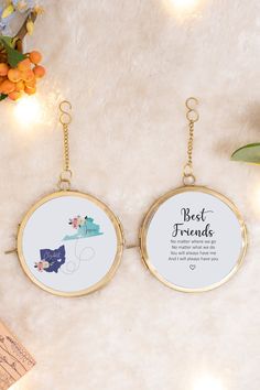 two personalized key chains hanging on a wall