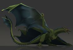 a green and black dragon sitting on top of a gray surface with its wings spread