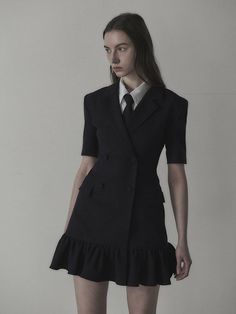 The slim fit jacket dress that made of lightweight spring fabric. Featuring the double-breasted closure with covered buttons, and the flared ruffle skirt that gives romantic mood. We recommend style with scarf, shirts, or neck-tie to create unique school look. - Notched lapel collar and half-sleeved design- Double-breasted closure with covered buttons- Flared ruffle skirt with snap button detail- Flap pockets and seam line detail at front- Slim and fitted silhouette, mini length- Lightweight polyester fabric for spring- Renewed slim fit version of previous 'Jenn Suit Jacket Dress' Chic Fitted Jacket Dress With Double-breasted Buttons, Feminine Fitted Blazer Dress For Work, Fitted Feminine Blazer Dress For Work, Chic Tailored Ruffle Blazer, Chic Tailored Blazer With Ruffles, Semi-formal Fitted Jacket Dress With Double-breasted Buttons, Fitted Jacket Dress With Double-breasted Button For Semi-formal Events, Spring Blazer With Ruffles For Workwear, Chic Ruffled Blazer For Office