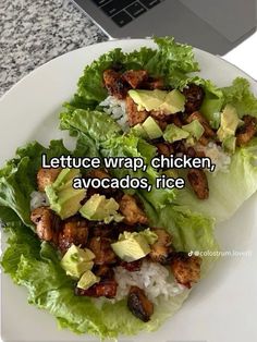 lettuce wrap, chicken, avocados, rice on a white plate