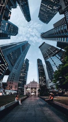 looking up into the sky at skyscrapers in london, england - image grat