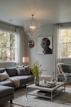 a living room filled with furniture and a chandelier