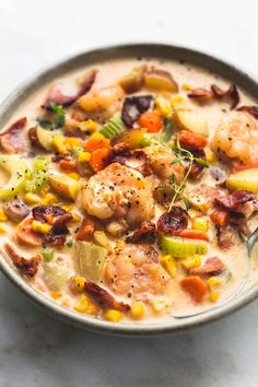 a close up of a bowl of soup with shrimp