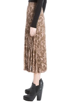 Crisp pleats create texture to a knee-length, midi skirt with decorative prints for an effortlessly chic look. Shell: 100% polyester; lining: 65% polyester, 35% rayon Dry clean Imported Model stats: 5'10" height, 32" bust, 25" waist, 36" hip. Model is wearing size S. Pleated Midi Skirt With Elastic Waistband For Work, Workwear Midi Length Pleated Skirt With Elastic Waistband, Elegant Knee-length Pleated Skirt With Elastic Waistband, Flowy Skirt With Folds For Spring, Knee-length Pleated Skirt With Elastic Waistband And Flowy Fit, Chic Midi-length Pleated Skirt With Elastic Waistband, Midi-length Workwear Bottoms With Folds, Chic Midi Length Pleated Skirt With Elastic Waistband, Chic Knee-length Pleated Skirt With Elastic Waistband