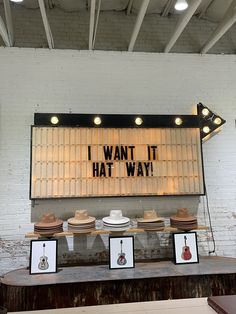 hats are on display in front of a sign that says i want it hat way