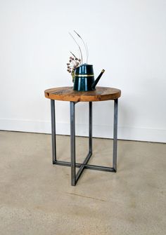 a table with a watering can on it