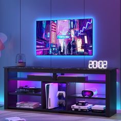 an entertainment center in a room with purple lighting