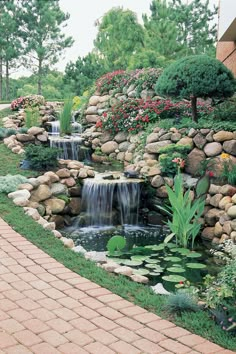 there is a small waterfall in the middle of this garden