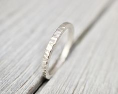 Unique, hammered solid sterling silver ring. looks equally good on its own or worn with others as a stacking ring! It is made from sterling silver wire, and has been hammered with a straight-edge hammer, and has its inside edge smoothed for a comfortable fit. This ring is 2mm wide, and is perfect for wearing everyday. It will arrive in a branded pouch, great for gift giving to yourself or a loved one. Designed and made from scratch by me in my Mount Hawthorn jewellery studio in Australia.  Thank Jewellery Studio, Hammered Silver Ring, Jewellery Silver, Silver Stacking Rings, Sterling Silver Jewellery, Jewelry Studio, Silver Rings Handmade, Hammered Silver, Straight Edge