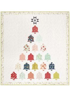 a quilted christmas tree with bells and stars on it's top, surrounded by snowflakes