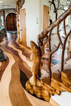 a wooden staircase with carved fish on it