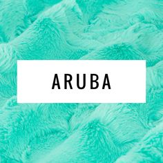 the word aruba written in black on top of a blue background with green fur