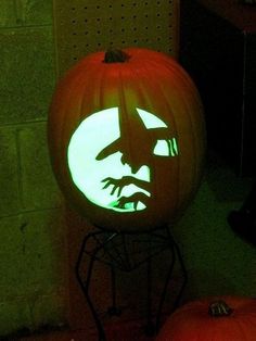 a pumpkin with a face carved into it