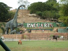 an animal park with dinosaurs and other animals