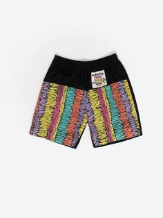 Vintage 80s Caribbean shorts with neon pattern. These 1980s black shorts feature a 'Caraïbes' graphic design and a bright neon pattern on the front and a neon pattern on the back pocket. These shorts also feature an elasticated waist and are made from a lightweight cotton. Our recommended size: Medium to large Label says: Small Condition: Very good Material: 100% cotton Measurements, laid flat, in inches:  Waist: 34 Inside leg: 18 Outside leg: 7 Front rise: 12 Hip (measured across the bottom of Retro Streetwear Bottoms With Built-in Shorts, 90s Black Graphic Print Bottoms, Summer Streetwear Athletic Shorts With Graphic Print, Retro Shorts With Pockets For Streetwear, Multicolor Athletic Shorts With Built-in Shorts For Spring, Black Rave Shorts For Summer, Black Short Length Rave Bottoms, Retro Graphic Print Bottoms For Streetwear, Retro Cotton Athletic Shorts For Summer