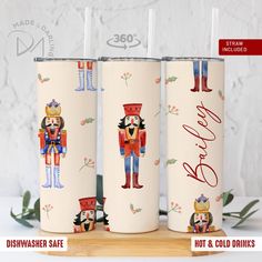 three personalized tumblers with nutcrackers on them