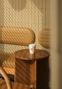 a coffee cup sitting on top of a wooden table