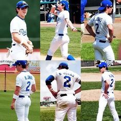 baseball players in white and blue uniforms on the field