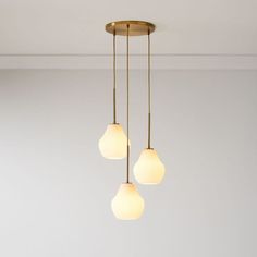 three lights hanging from a ceiling in a room