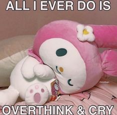 a pink hello kitty stuffed animal laying on top of a bed with the caption, all i ever do is overthik and cry