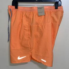 Nike Mens Dri-Fit Stride Running Shorts 7" Peach Orange Size Xl Dm4761-871 Nike Running Bottoms With Pockets, Orange Training Shorts, Orange Sporty Swim Trunks For Sports, Orange Sporty Swim Trunks, Sporty Orange Swim Trunks For Sports, Orange Sportswear Shorts For Gym, Orange Sports Shorts With Pockets, Orange Sporty Running Bottoms, Sporty Orange Running Bottoms