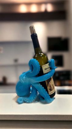 an octopus wine bottle holder on a counter