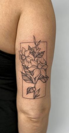 a woman's arm with a flower tattoo on the left side of her body