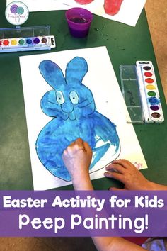 a child's hand is drawing an easter bunny for kids to paint on paper