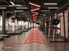 an empty gym with rows of treadmills and machines