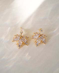 Discover a new level of elegance with our Ella Ear Jackets! Made with sparkling cubic zirconia and designed in the shape of delicate leaves, these earrings will enhance your natural beauty and elevate any outfit. Treat yourself or someone special to these stunning little luxuries! EARRINGS FEATURE Material: Brass, White Cubic Zirconia Finish: 16K gold plating Elegant Leaf-shaped Earrings, Elegant Leaf-shaped Earrings For Formal Occasions, Elegant Leaf-shaped Formal Earrings, Ear Jacket, Freshwater Pearls Earrings, Someone Special, Pretty Earrings, Moonstone Ring, Opal Necklace